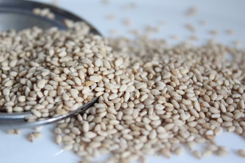 Sesame seeds on spoon
